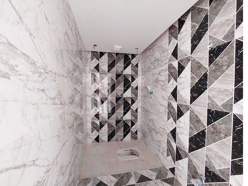 تصویر یک ویلای نما مدرن و محوطه سازی شده با موزاییک و چمن مصنوعی